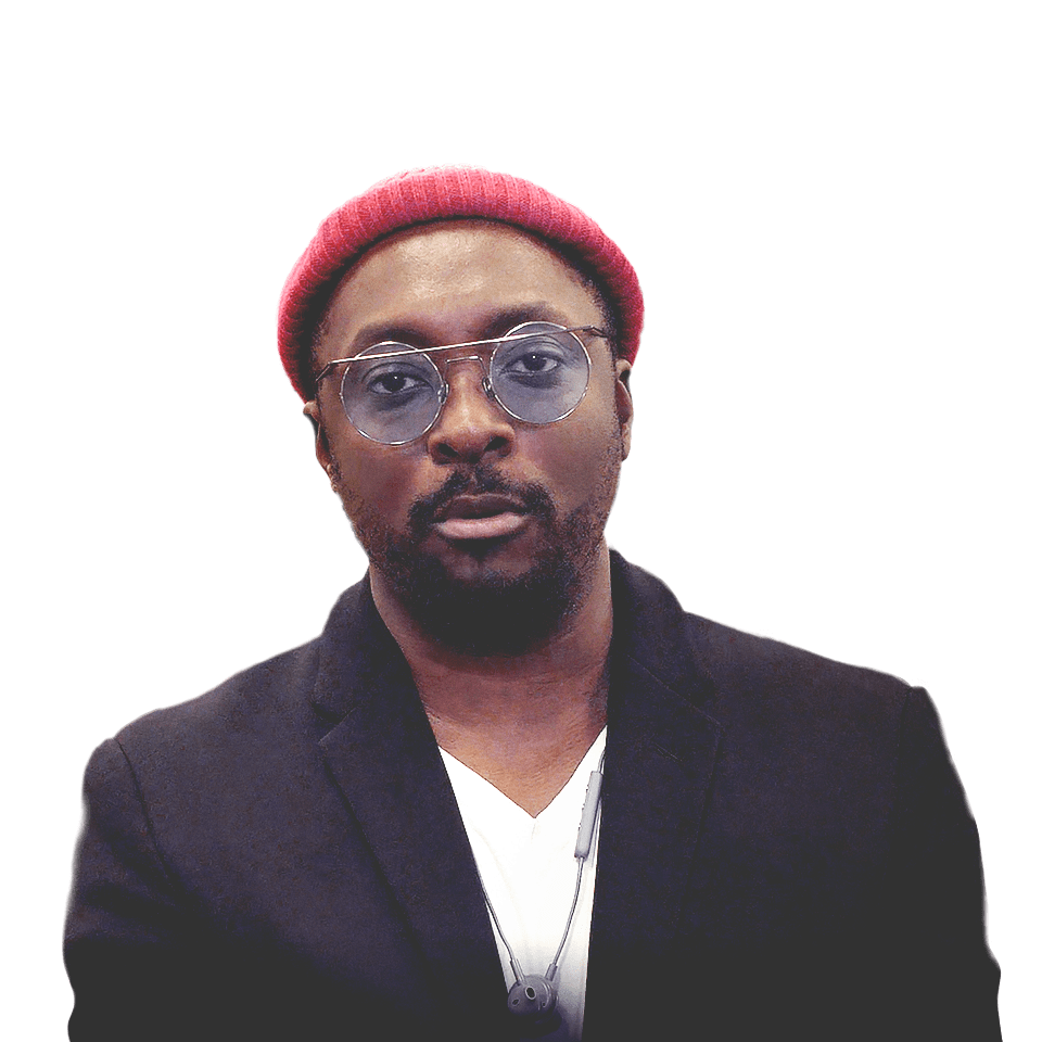 Will.I.Am, artista ganador de un Grammy y activista de SIG, con un aula de fondo